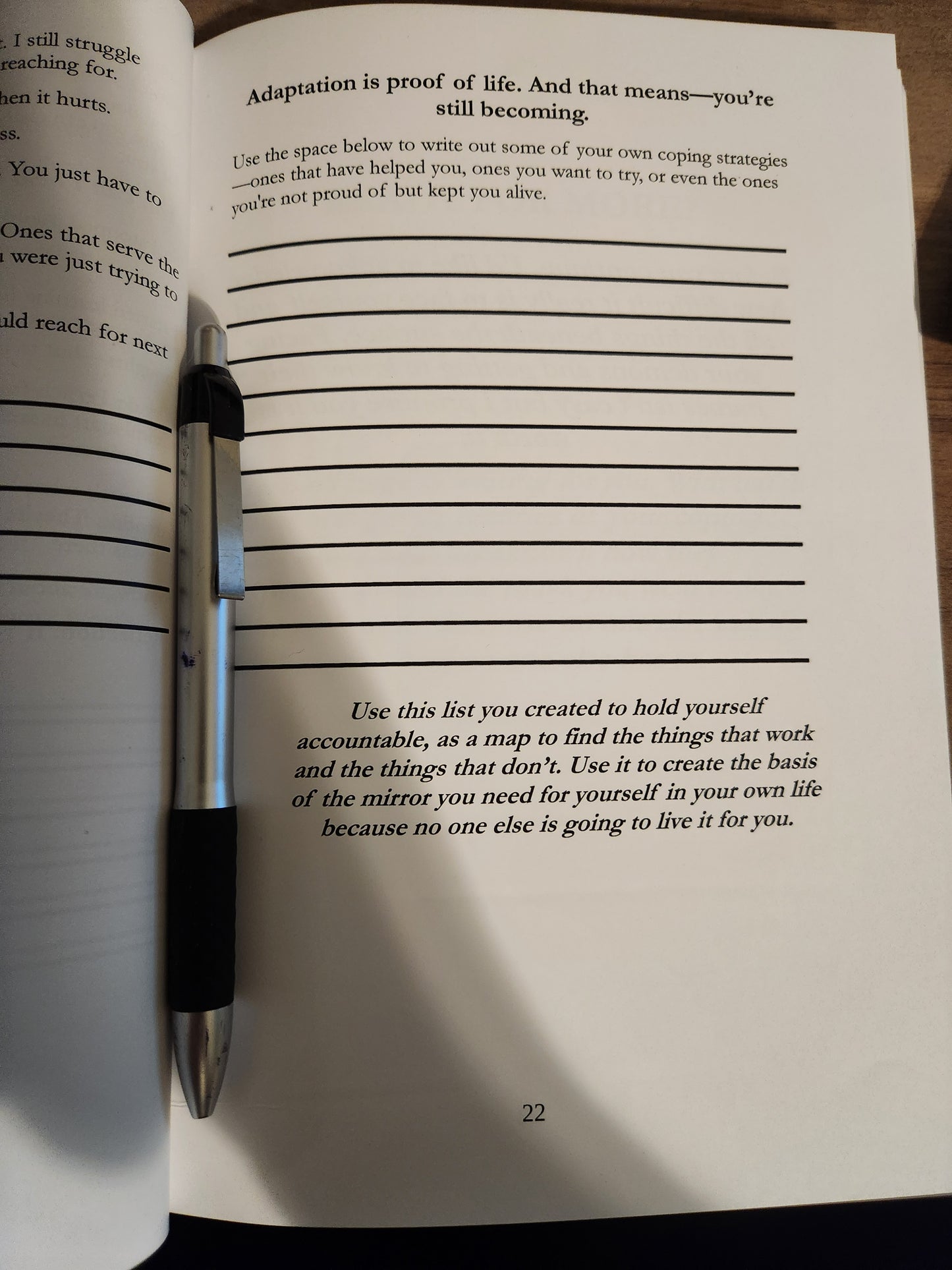 Pen on an open book with text